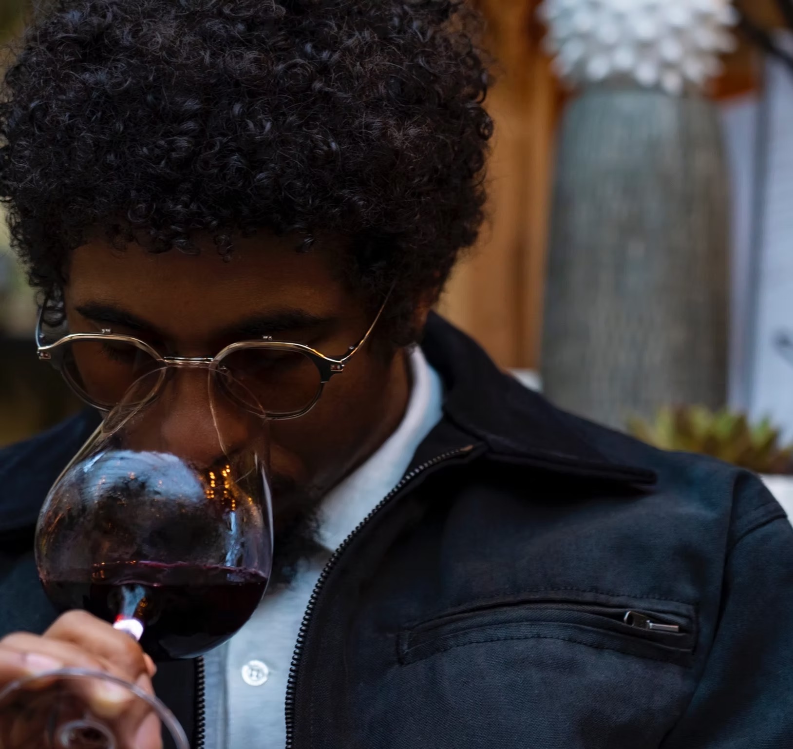 Chris Lyons savoring a glass of red wine